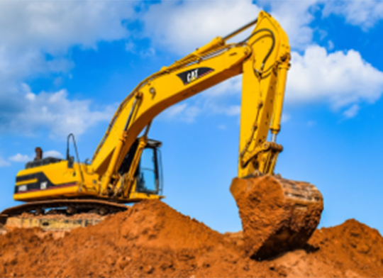 A large 360-degree excavator (A56) in operation on a construction site, lifting soil with its bucket.